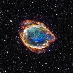 This debris field, which glows brightly in X-rays, was left over when a star exploded about 4,500 years ago.  This object, known as G299.2-2.9, belongs to a particular class of supernovas called Type Ia.  Astronomers think that a Type Ia supernova involves a thermonuclear explosion - involving the fusion of elements and release of vast amounts of energy - of a white dwarf star in a tight orbit with a companion star. In the Chandra image, red, green, and blue represent low, medium, and high-energy X-rays, respectively, detected by the telescope. The X-rays have been combined with optical and infrared data, which show the stars in the Chandra field of view.